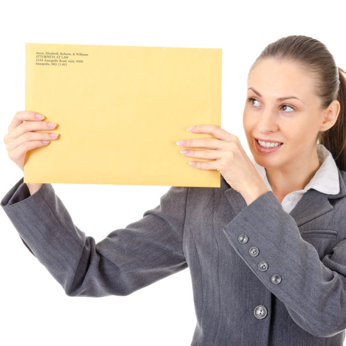Woman holds a custom printed large brown envelope with corporate branding